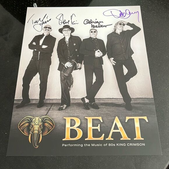 Poster by the band BEAT which is King Crimson and it’s signed by king crimson